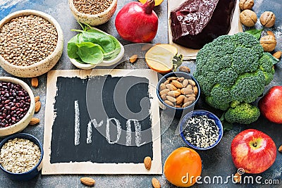 Fruits, vegetables, legumes, nuts and liver with high iron content. Food with iron. View from above. Place for text. Stock Photo