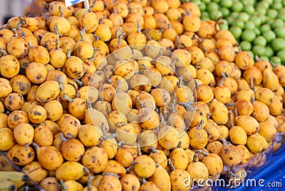 Fruits and vegetables in market closeup. Mature appetizing pears on counter Stock Photo