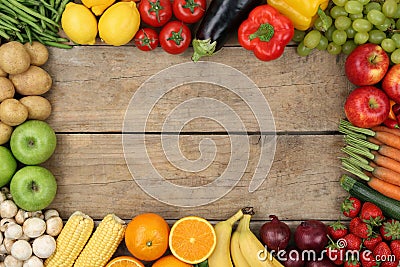 Fruits and vegetables on wooden board with copyspace Stock Photo