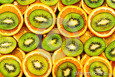 Fruity background set of slices of orange fruit and kiwi. Many slices of kiwi fruit and orange fruit, Stock Photo