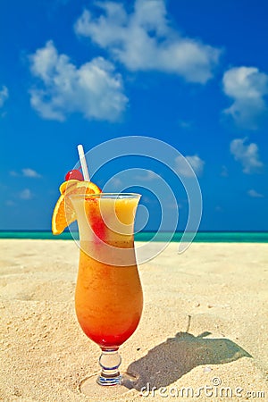 Fruity cocktail is on a beach Stock Photo