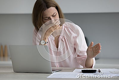 Frustrated broke business woman, entrepreneur, homeowner crying over calculator Stock Photo