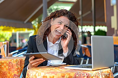 Frustrated businesswoman yelling into her mobile Stock Photo