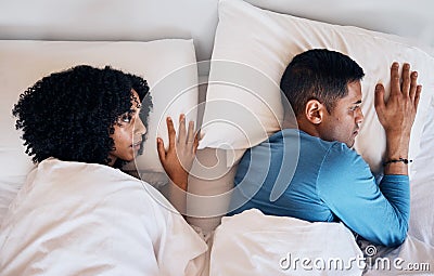 Frustrated couple, fight and lying in bed conflict, divorce or argument from disagreement or dispute at home. Top view Stock Photo