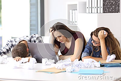 Frustrated entrepreneurs surrendering at office Stock Photo