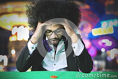 Frustrated gambler man losing on a gamble Stock Photo