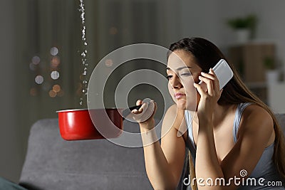 Frustrated girl calling insurance about water leaks Stock Photo