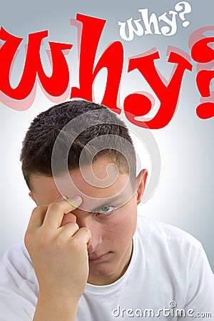 Frustrated handsome teenager asking himself Why? Why? Stock Photo