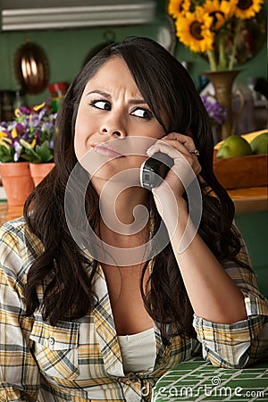 Frustrated Latina Woman on Phone Stock Photo