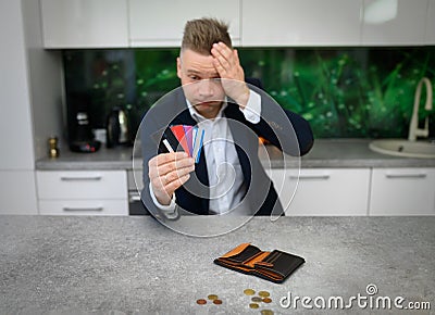 Frustrated man in heavy credit card debt Stock Photo