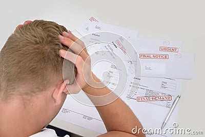 Frustrated Man With Unpaid Bills Stock Photo