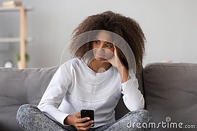 Frustrated mixed race teen girl received unpleasant message Stock Photo