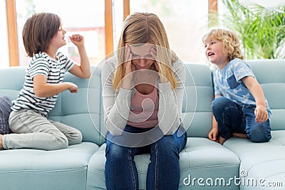 Frustrated mother with children Stock Photo