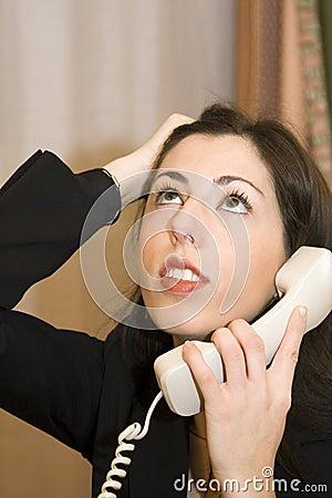 Frustrated Office Worker on Phone Stock Photo