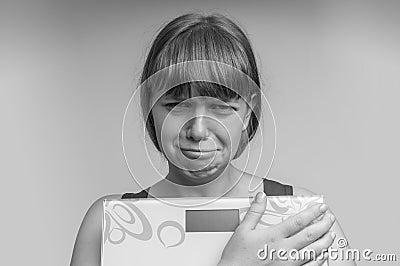 Frustrated overweight woman with scales Stock Photo