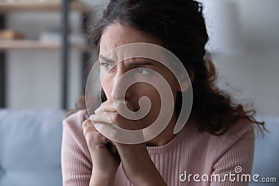Frustrated stressed young woman thinking of difficult decision. Stock Photo