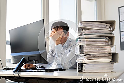 Frustrated Tired Man With Invoices Stock Photo