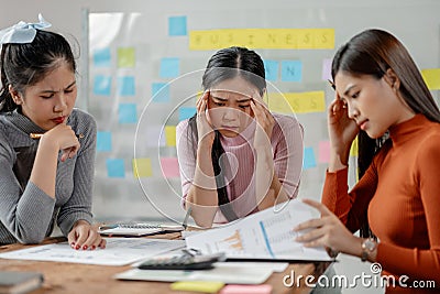 Frustrated upset multiracial business team people sad with bad work result in report disappointed in corporate Stock Photo