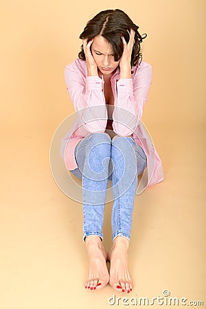 Frustrated Upset Stressed Lonely Young Woman Sitting on Floor Stock Photo