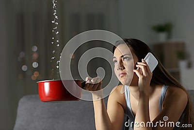 Frustrated woman claiming insurance for water leaks Stock Photo