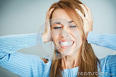 Frustrated woman covering ears with hands Stock Photo