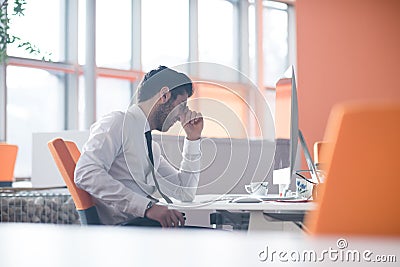 Frustrated young business man at work Stock Photo