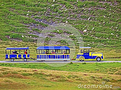 Frutt train Frutt-Zug - tourist-passenger mini road train in the area of the alpine lakes Melchsee and Tannensee, Melchtal Editorial Stock Photo