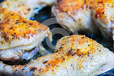 Fry chicken legs in a pan with spices. Stock Photo