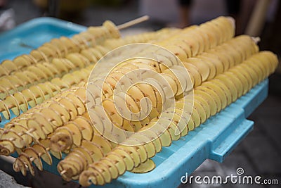 Fry twist slice potato insert on bamboo Stock Photo