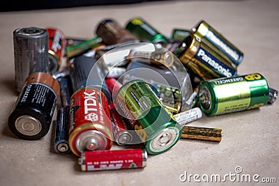 Fryazino, Russia - 06 21 2018: a bunch of used batteries, disposal of hazardous waste concept Editorial Stock Photo