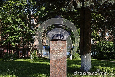 Portrait sculpture of hero of socialist labor Vladimir Vok, ex worker of Istok State Scientific Production. Sunny summer view. Editorial Stock Photo