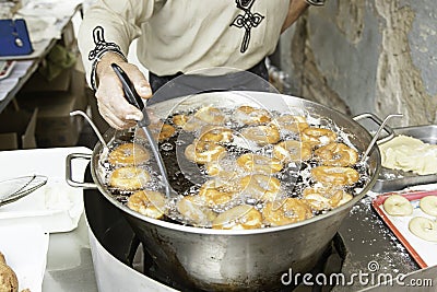 Frying donuts in the street Stock Photo