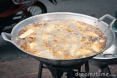 Frying food in hot oil deep fried boiling Stock Photo