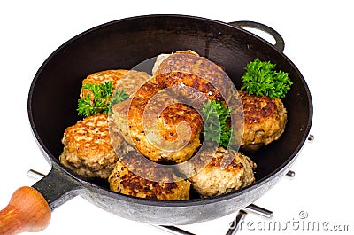 Frying pan with fried cutlets on white background Stock Photo