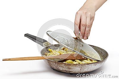 Frying pan with fried potatoes. Stock Photo