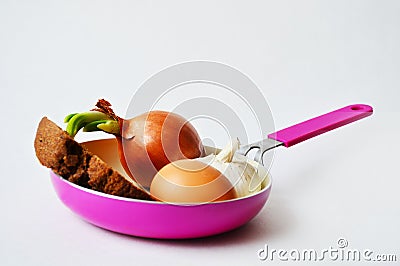 Frying pan with sprout, bread, egg and garlic Stock Photo