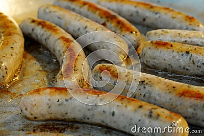 Frying sausages Stock Photo
