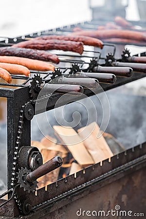 Frying sausages on a home made grill Stock Photo