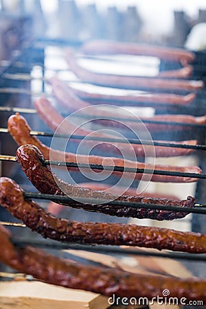 Frying sausages on a home made grill Stock Photo