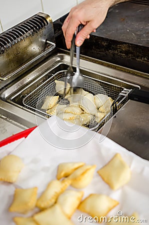 Frying torta frita in a steel basket Stock Photo