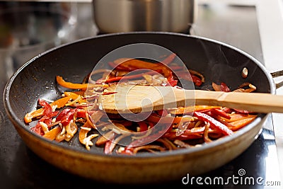 Frying vegetables in a pan Stock Photo