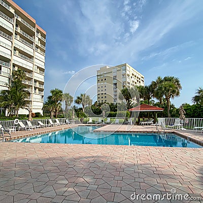 A condominium swimming pool area in Florida Editorial Stock Photo