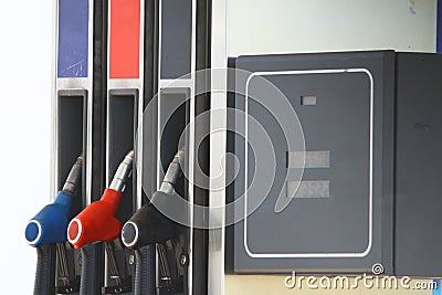 Fuel pistols gas pump nozzles on fuel station and the fuel meter. Stock Photo