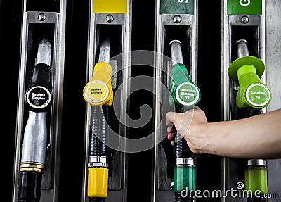 Fuel pump station close up of diesel and gasoline nozzles pumps Editorial Stock Photo