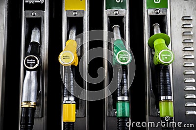 Fuel pump station close up of diesel and gasoline nozzles pumps Editorial Stock Photo