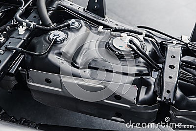 Fuel tank inside car chassis underbody Stock Photo