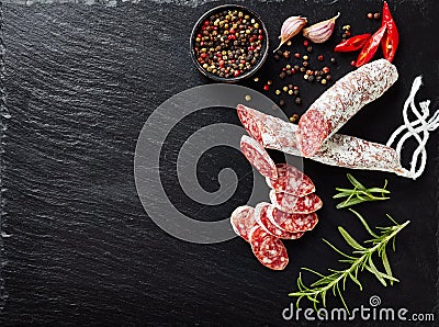 Fuet sausage cut in slices, flatlay Stock Photo