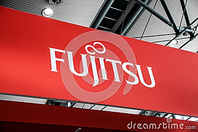 Fujitsu company logo sign on exhibition fair Cebit 2017 in Hannover Messe, Germany Editorial Stock Photo