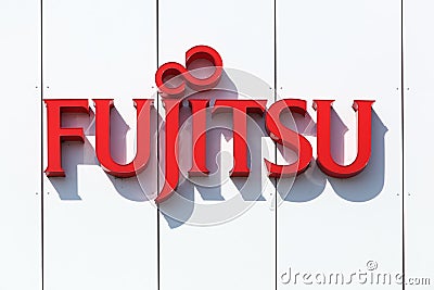 Fujitsu logo on a wall Editorial Stock Photo