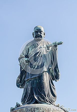 FUKUOKA, JAPAN - NOVEMBER 6: The bronze statue of Nichiren Shonin Editorial Stock Photo